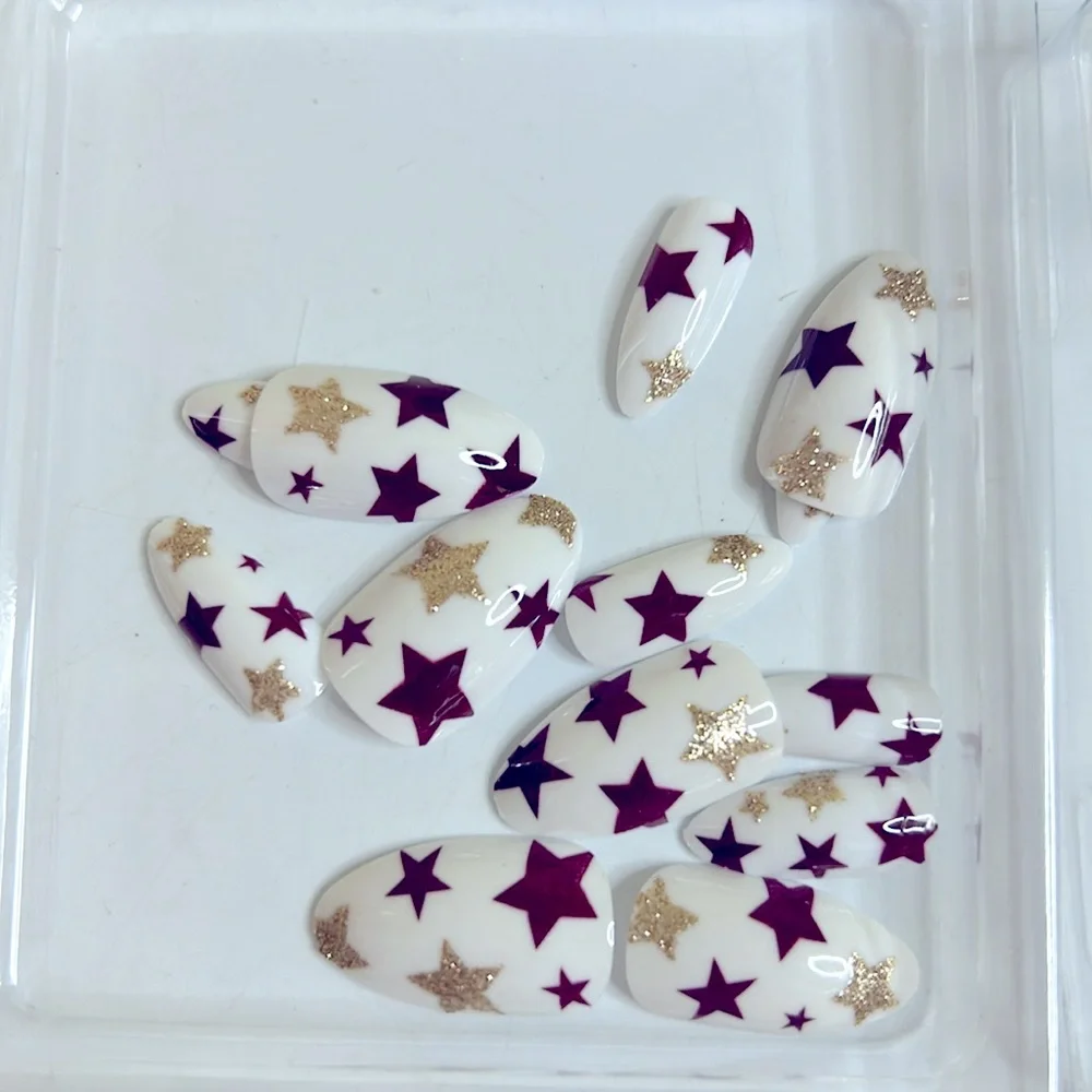Red And Gold Stars On White Medium Almond Press-On Nails VAVAVAILS